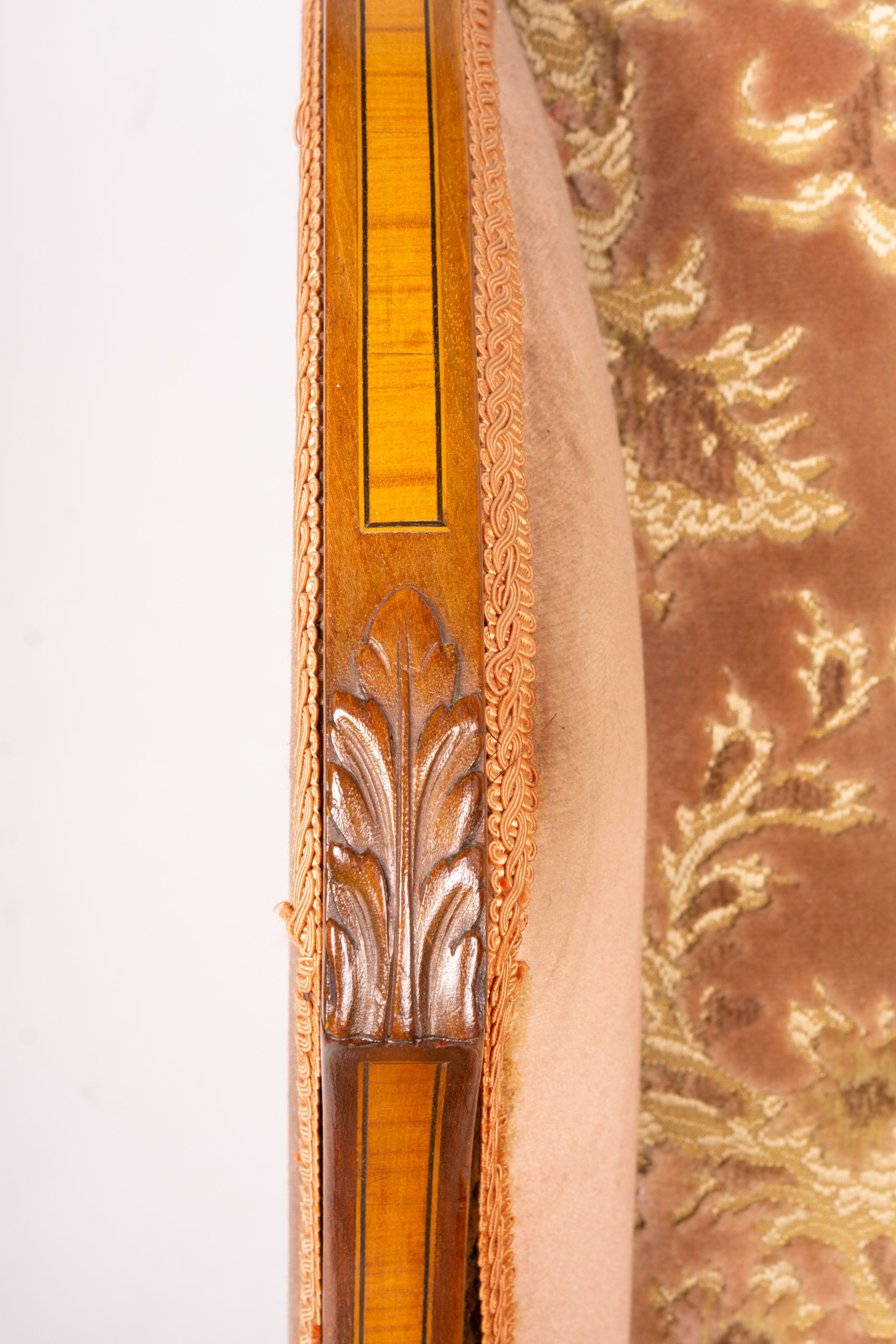 A pair of Edwardian satinwood banded mahogany wing armchairs, width 56cm, depth 75cm, height 110cm